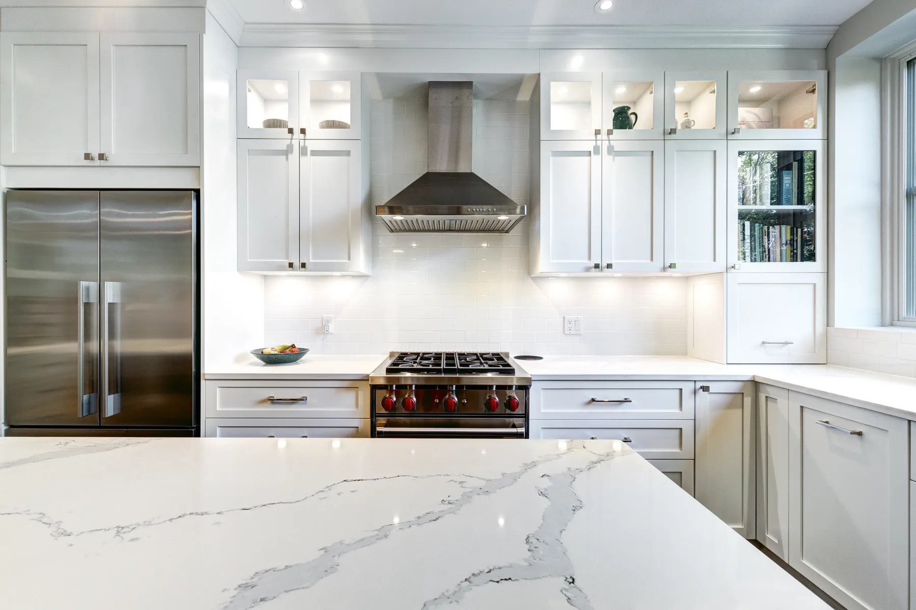 High-gloss white chef kitchen